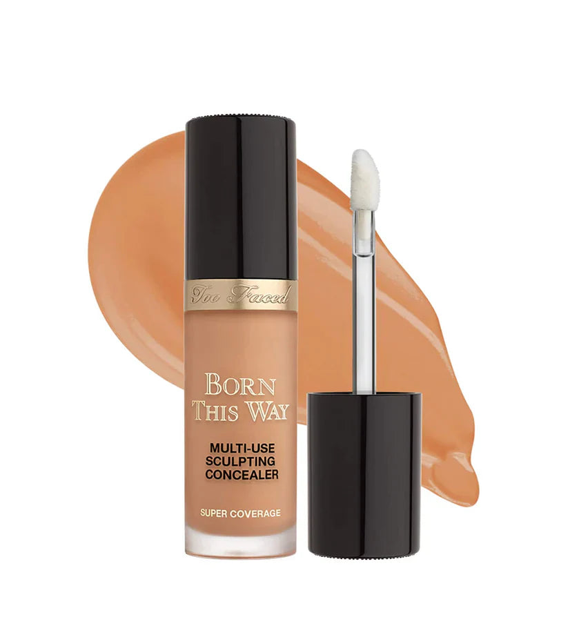 Makeup concealer bottle with applicator on a white background