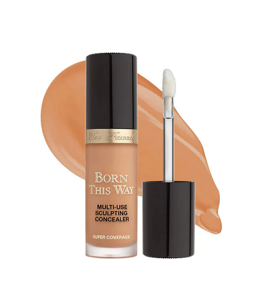 Makeup concealer bottle with applicator on a white background