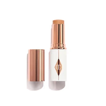 Makeup stick with rose gold cap and white body on a white background