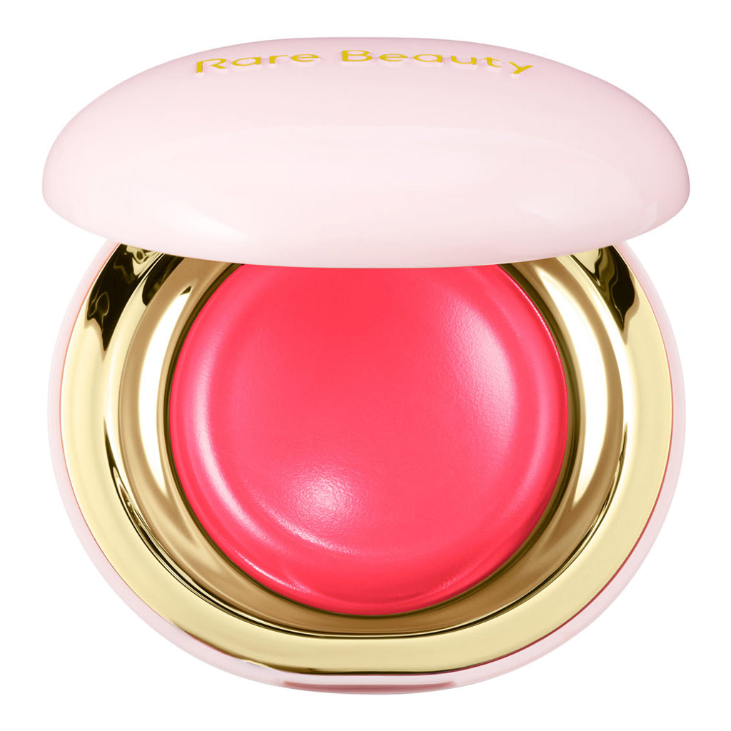 Pink blush compact with gold base and 'Rare Beauty' branding on a white background