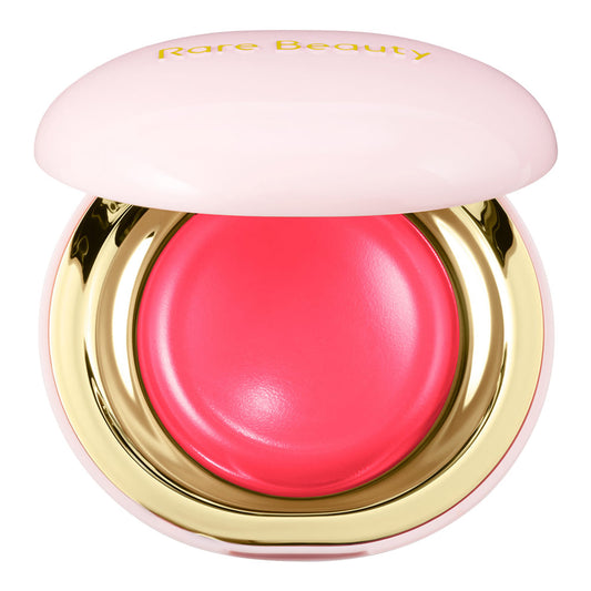 Pink blush compact with gold base and 'Rare Beauty' branding on a white background